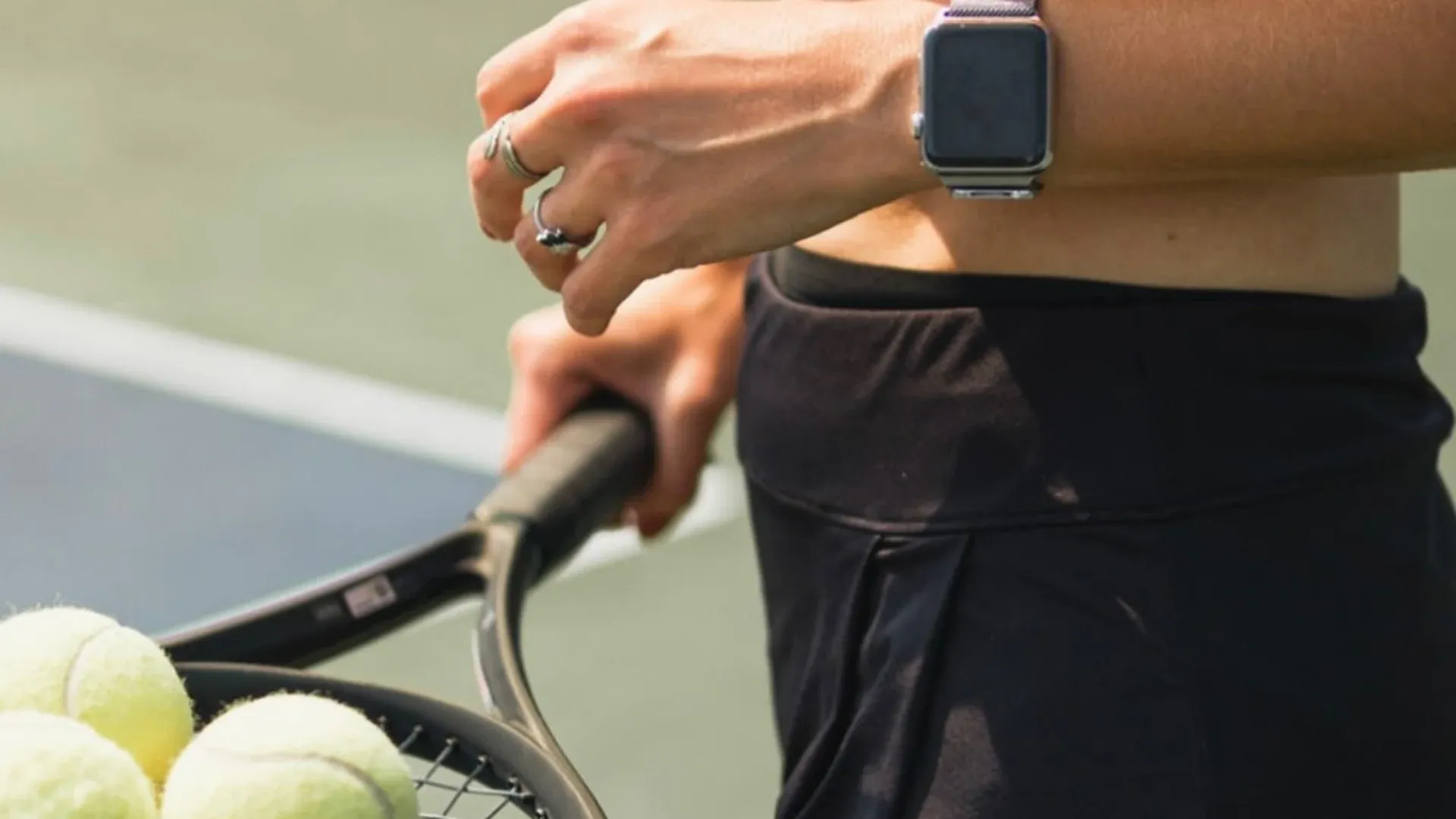 Coach reviewing video footage with a player at the lakeside courts